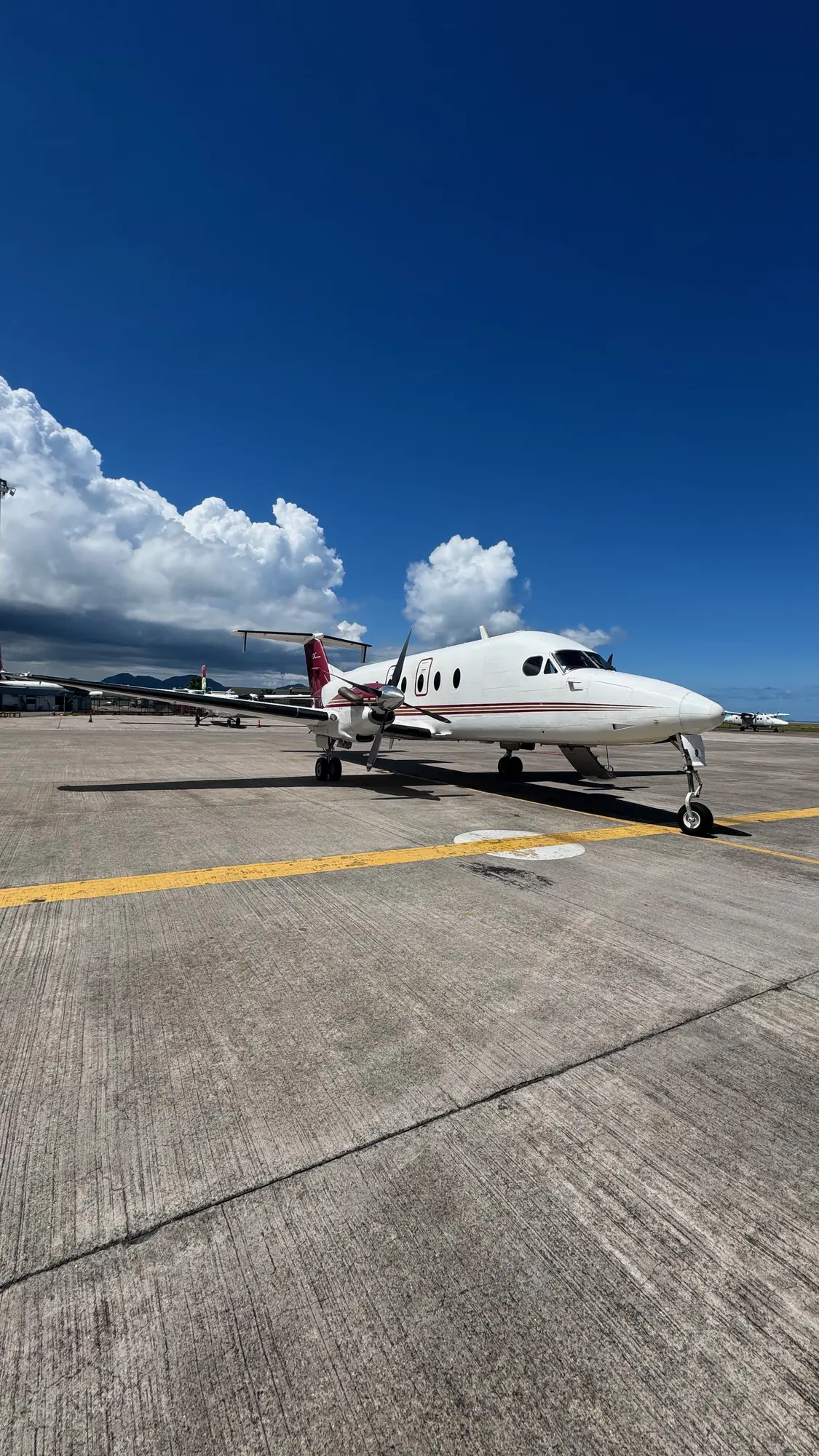 A small island plane waiting on the runway on Platte Island, Seychelles