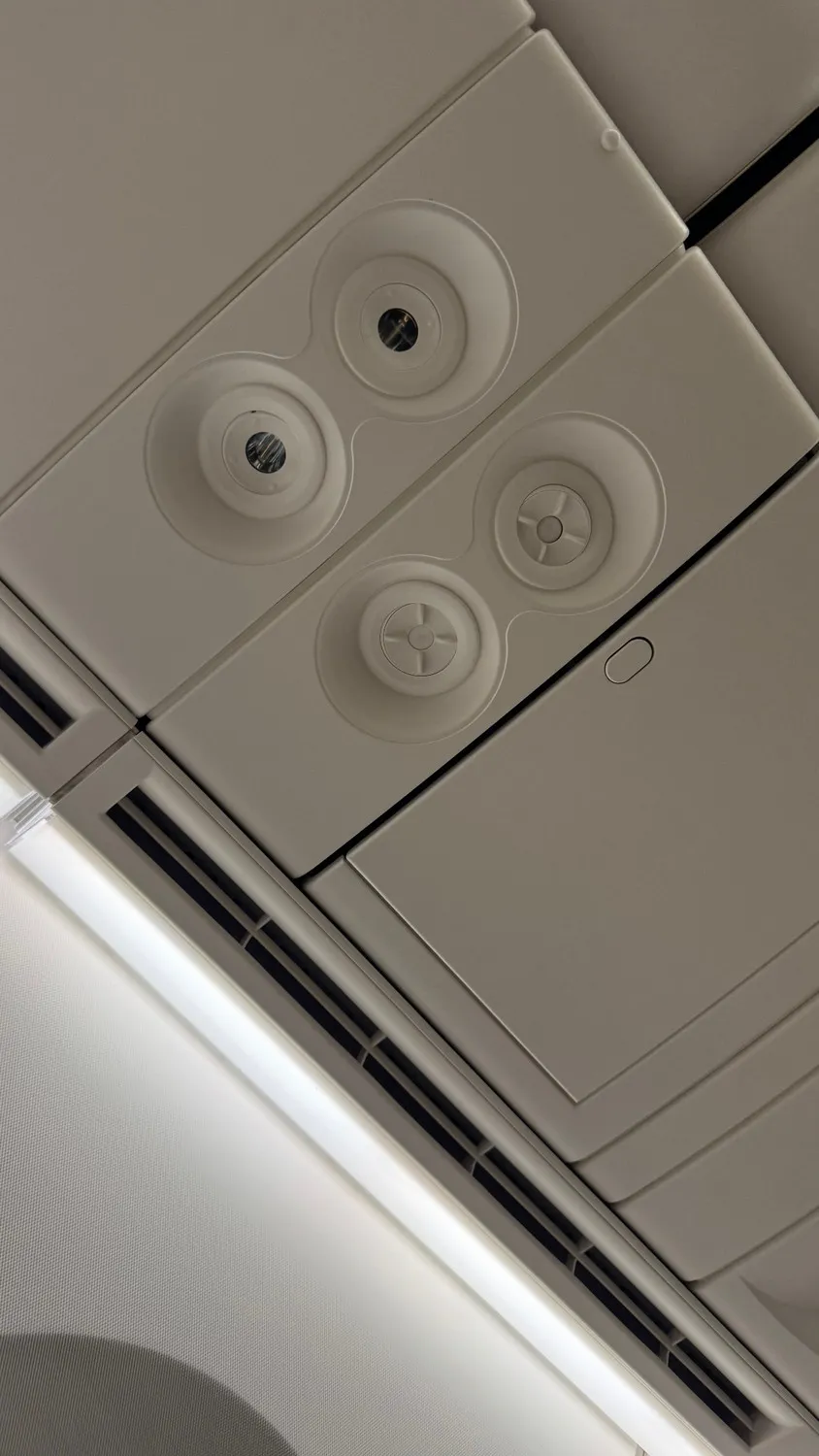 Personal air vents above my suite. Love having this on a long flight!