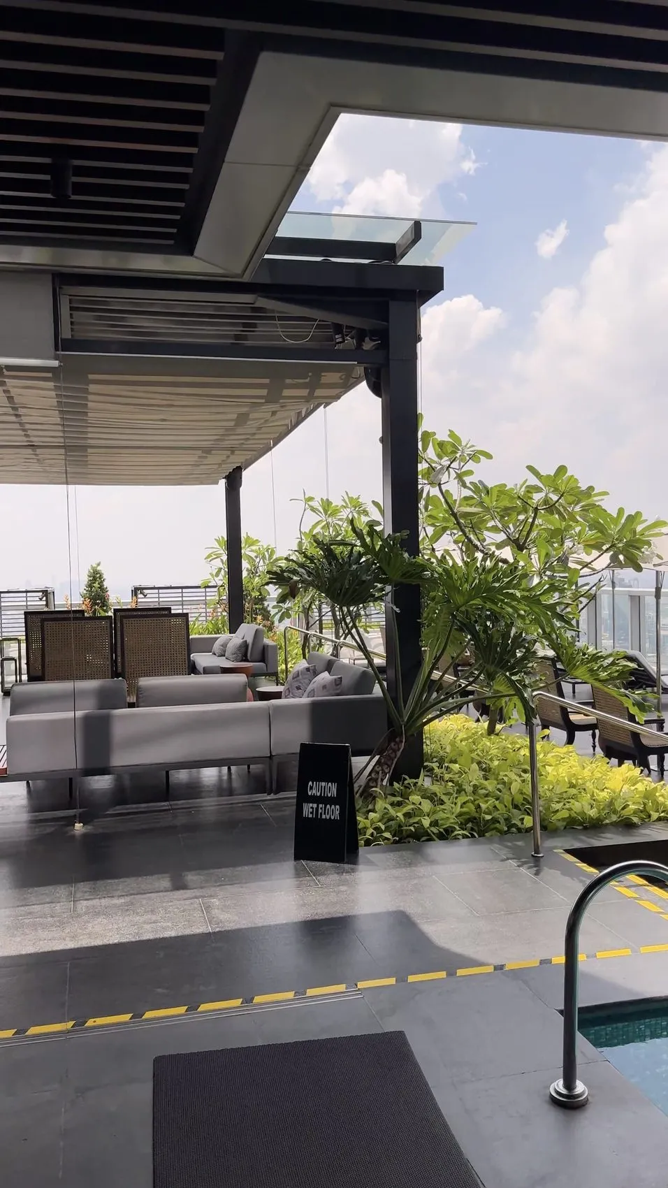 A peaceful poolside terrace, far above the busy streets below.